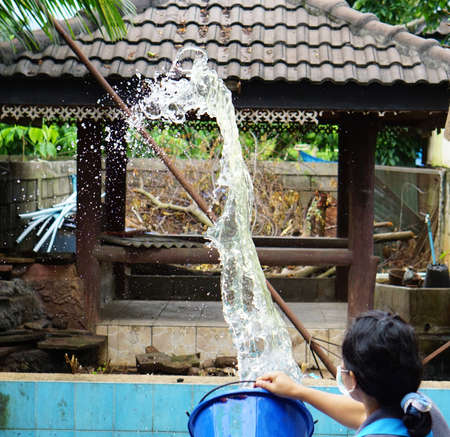 Cleaning staff were splashing water to wash the roofの写真素材
