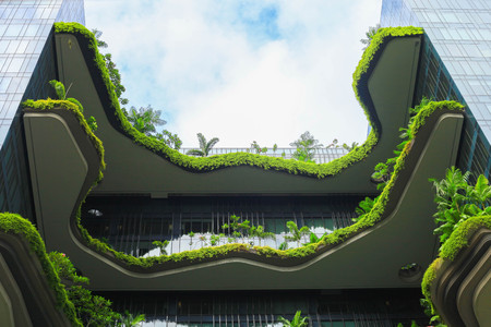 Singapore, Singapore - June 05, 2017 : Green nature facade on modern futuristic building in Singapore cityの写真素材