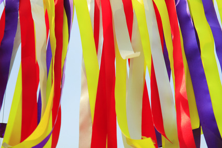 Multicolored fabrics that have been exposed to a white backgroundの写真素材