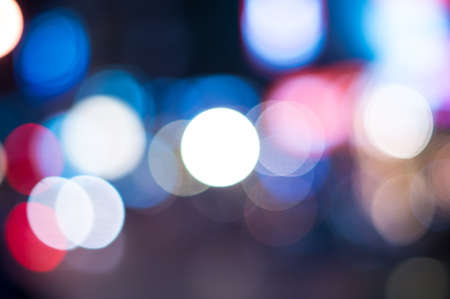 Blurred defocused lights background of city at nightの写真素材