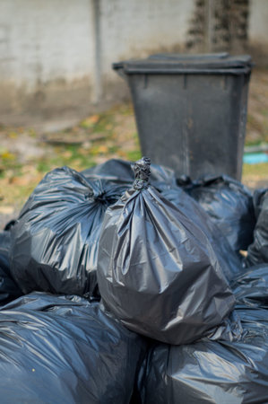 garbage bins with black garbage bags