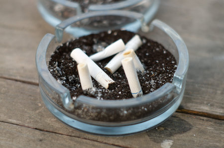 Cigarettes in a dirty ashtray