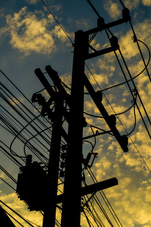electricity post in the sunsetの写真素材