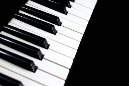 Piano keyboard on black backgroundの写真素材
