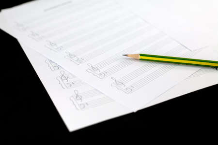 Empty music sheet with pencilの写真素材