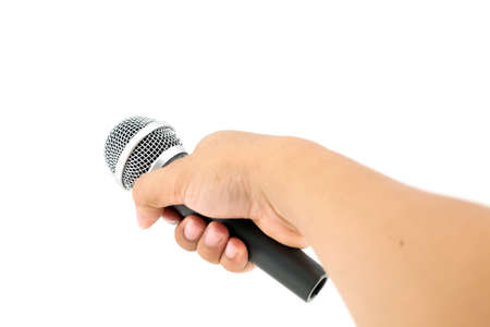 hand with a microphone isolated on whiteの写真素材