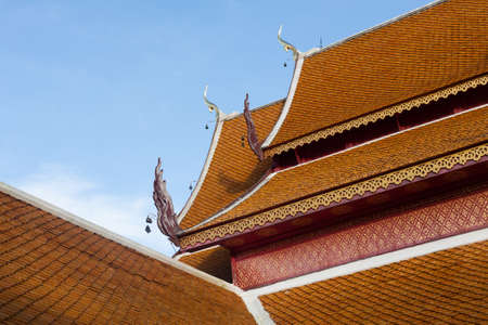 Temple roof in thailand with skyの写真素材