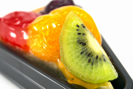 Fruit pie cake decorated with strawberry blueberry orange and kiwi