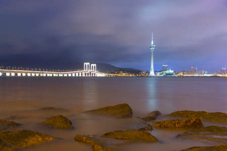 Macau Tower and Ponte de Sai Van bridge This photo was shot in the evening after sunset.の写真素材