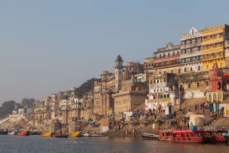 This photo was shot from Varanasi, India in the morning. The soft sun light touch the old building along the ganga river. Varanasi is a North Indian city on the banks of the Ganges in Uttar Pradesh. It is one of the oldest continuously inhabited cities inのeditorial素材