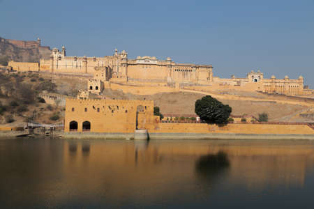 Amber Fort is located in Amer, 11 kilometres from Jaipur, Rajasthan state, India. It is one of the principal tourist attractions in the Jaipur area, located high on a hill. It Was Built By  Raja Man Singh I and is known for its artistic style, blending both Hindu and Rajput elements. With its large ramparts, series of gates and cobbled paths, the fort overlooks the Maota Lake, at its forefront.の写真素材