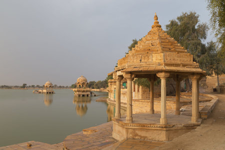 The Gadisar Lake in the city of Jaisalmer is one of the primary tourist attractions of the region. It is originally conceived as a water conservation tank to fulfil the water requirements of this acrid city by the then maharaja of Jaisalmer, Maharwal Gadsi Singh, around the year 1400 AD.の写真素材