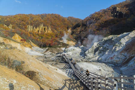 Noboribetsu Onsen is Hokkaido's most famous hot spring resort. A large amount of Noboribetsu's many types of hot spring water surfaces in the spectacular Jigokudani orの写真素材