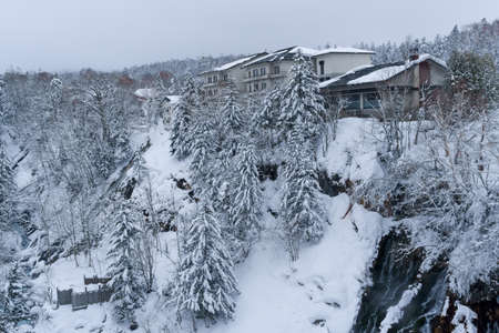 shirahige waterfall located 600 meters above sea leven in the Shirogane hot spring village of Biei City, this waterfall stands more than 30 meters tall. The water flowing down the gaps between the rocks resembles a white beard.の写真素材