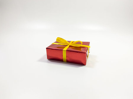 Birthday sparkling gift box in red and yellow, isolated white background