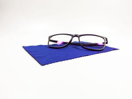 Free photo glasses and eye chart on whitw Background and The base is blue