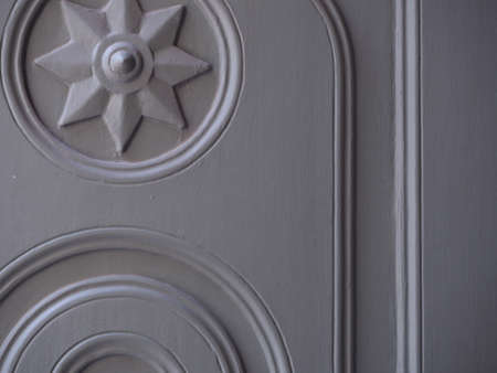 gray wooden door in a beautiful patterned tampleの写真素材
