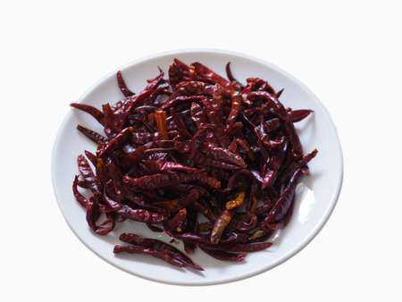 dried chilli,colorful tongue on a white plateの写真素材