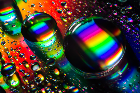 Water drop on cd effect rainbowの写真素材