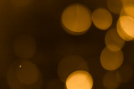 abstract bokeh background dark yellow color