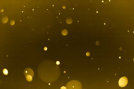 abstract bokeh background dark yellow colorの写真素材