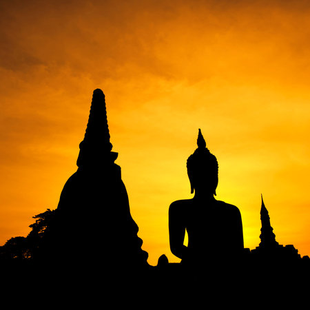 Silhouette Buddha Statue in Wat Mahathat Temple in Sukhothai Historical Park, Sukhothai Province, Thailand .の写真素材