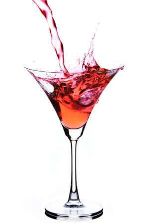Glass with red wine splashの写真素材