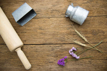 Vintage Style, bucket Vintage and flowers on the background of wood.の写真素材