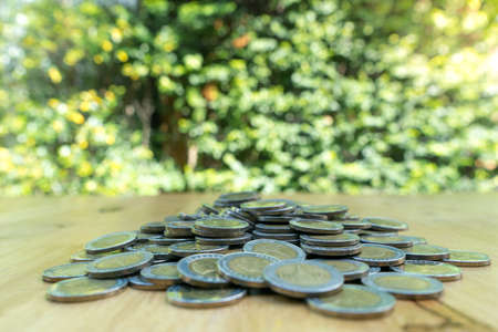 Saving money coins, money concept, coins money collect foe save on green background.の写真素材