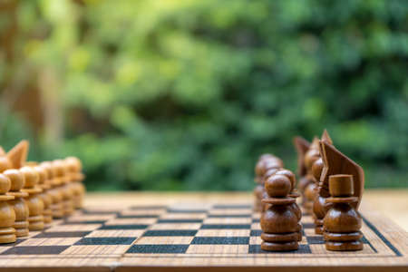 wooden chess board with wooden chess piecesの写真素材