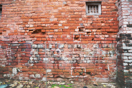 Weathered Brick Wall with Damage and Patches