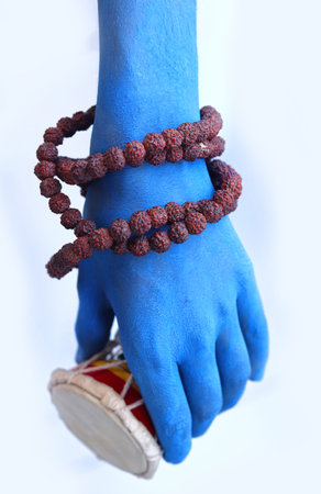 Pellet Drum (Damroo) Musical instrument in hand (shiva hand) Maha shivratriの写真素材