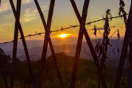 Sunset at Doi Chang Mub , Mae Fa Luang ,Chiang Rai , Thailand .の写真素材