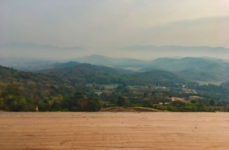 The landscape of mountains is full of clouds and fog. A top view of the haze in the mountains And fog in the morning at Doi Sako Mountain, Chiang Saen, Thailandの写真素材