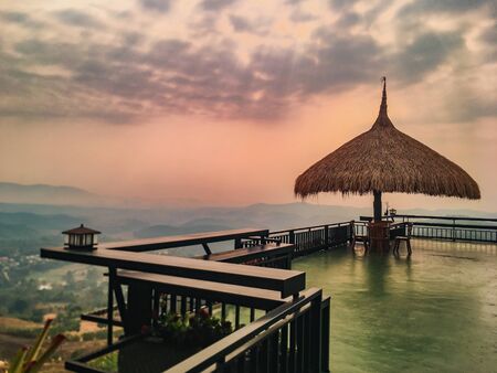 The landscape of mountains is full of clouds and fog. A top view of the haze in the mountains And fog in the morning at Doi Sako Mountain, Chiang Saen, Thailandの写真素材