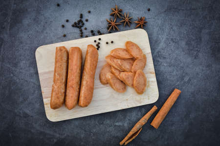 Sausage Or Guan Chiang and Herbs on the board, serving good beer snacks on a dark background.の写真素材