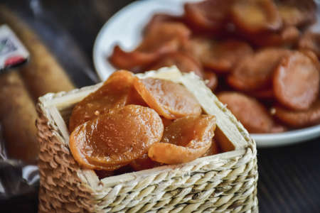Sausage Or Guan Chiang and Herbs on the board, serving good beer snacks on a dark background.の写真素材