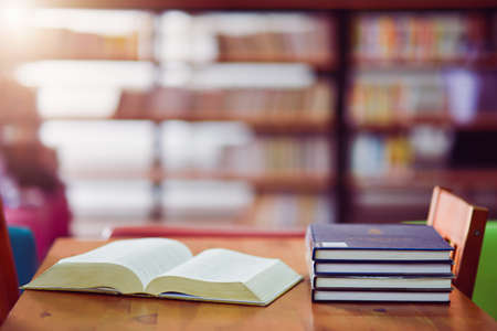 Open book on the table in libraryの写真素材