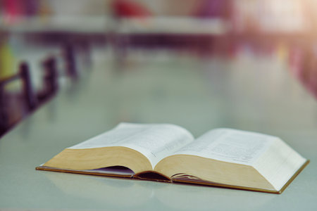Open book on the table in libraryの写真素材