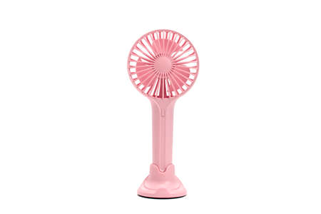 Closeup of a small pink fan isolated on white background.の写真素材