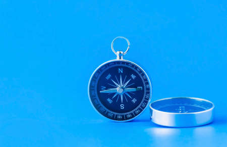 compass isolated on blue background life goal concept compass pointing the wayの写真素材