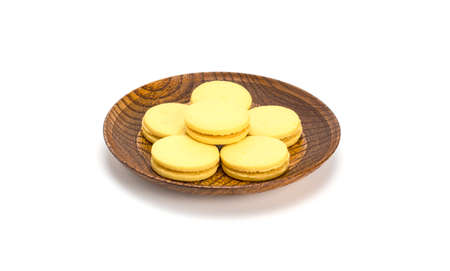 Stuffed cookies in a wooden plate isolated on a white backgroundの写真素材