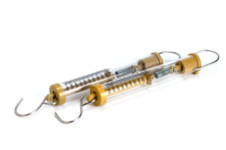 Compact spring balancer with hook isolated on a white backgroundの写真素材