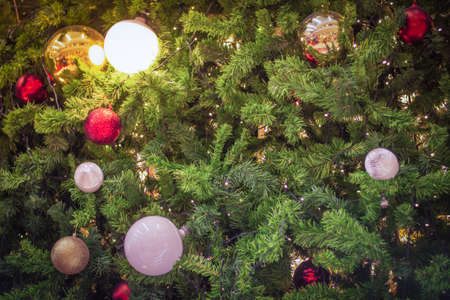Decorate Christmas tree on blurry, sparkling and bokeh background.の写真素材