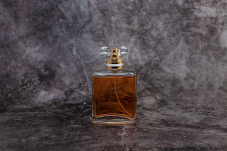 orange woman perfume on dark backgroundの写真素材