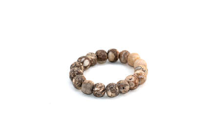 Closeup of stone bracelets isolated on white background.の写真素材