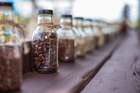 Rows of coffee in glass bottles Concept of different types of coffeeの写真素材
