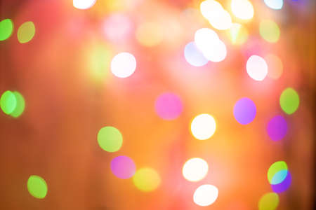 Golden and multicolored bokeh circle background for Christmas and happy new year with space to display messagesの写真素材