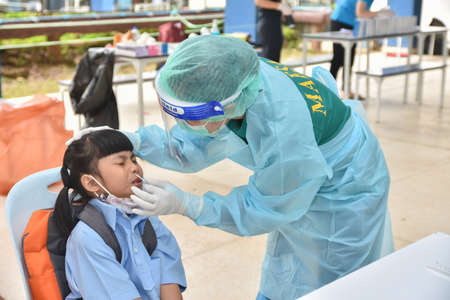 10 Nov 2021; Chiang Rai, Thailand:Teachers use rapid self-testing antigen kits. (atk)Covid-19 test for studentsのeditorial素材