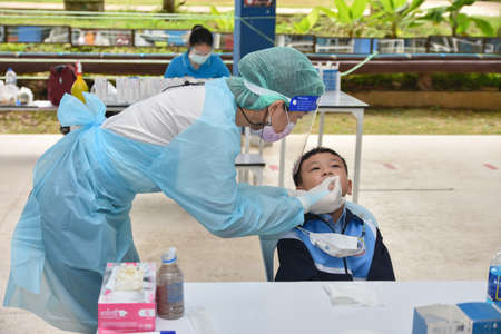 10Nov 2021; Chiang Rai, Thailand:Teachers use rapid self-testing antigen kits. (atk)Covid-19 test for studentsのeditorial素材